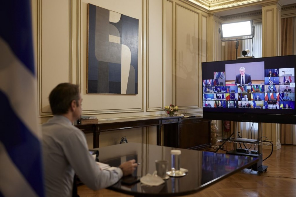 Greece's Prime Minister Kyriakos Mitsotakis speaks with EU leaders during an EU summit, via videoconference , from his office in Athens, Thursday, Feb. 26, 2021 (Dimitris Papamitsos/Greek Prime Minister's Office)