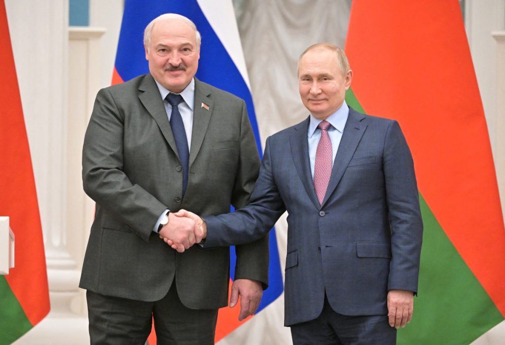 Russian President Vladimir Putin and Belarusian President Alexander Lukashenko shake hands during a joint news conference in Moscow, Russia February 18, 2022. Sputnik/Sergey Guneev/Kremlin via REUTERS ATTENTION EDITORS - THIS IMAGE WAS PROVIDED BY A THIRD PARTY.