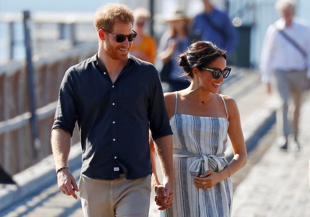 FILE PHOTO: Britain's Prince Harry and Meghan, Duchess of Sussex, arrive to greet members of the public in Kingfisher Bay on Fraser Island in Queensland, Australia October 22, 2018. REUTERS/Phil Noble