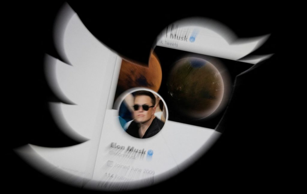 Elon Musk twitter account is seen through Twitter logo in this illustration taken, April 25, 2022. REUTERS/Dado Ruvic/Illustration