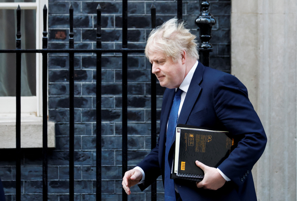 British Prime Minister Boris Johnson leaves Downing Street, in London, Britain, February 24, 2022. REUTERS/Peter Cziborra