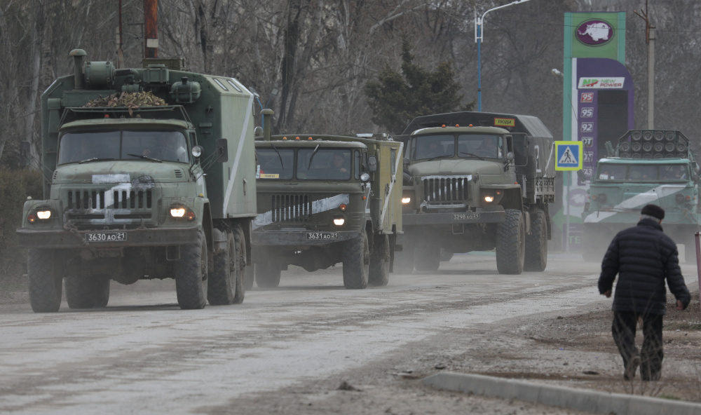 Russian Army military vehicles drive along a street, after Russian President Vladimir Putin authorized a military operation in eastern Ukraine, in the town of Armyansk, Crimea, February 24, 2022. REUTERS/Stringer