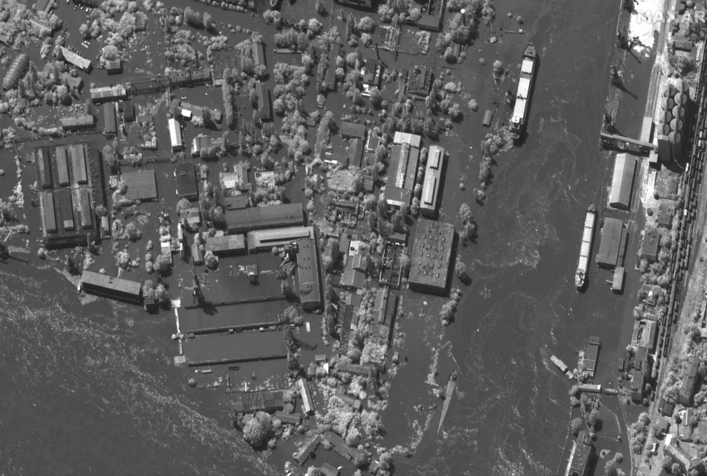 This satellite image provided by Maxar Technologies shows flooded port facilities and industrial area in Kherson, southern Ukraine on Tuesday, June 6, 2023. (Maxar Technologies via AP)